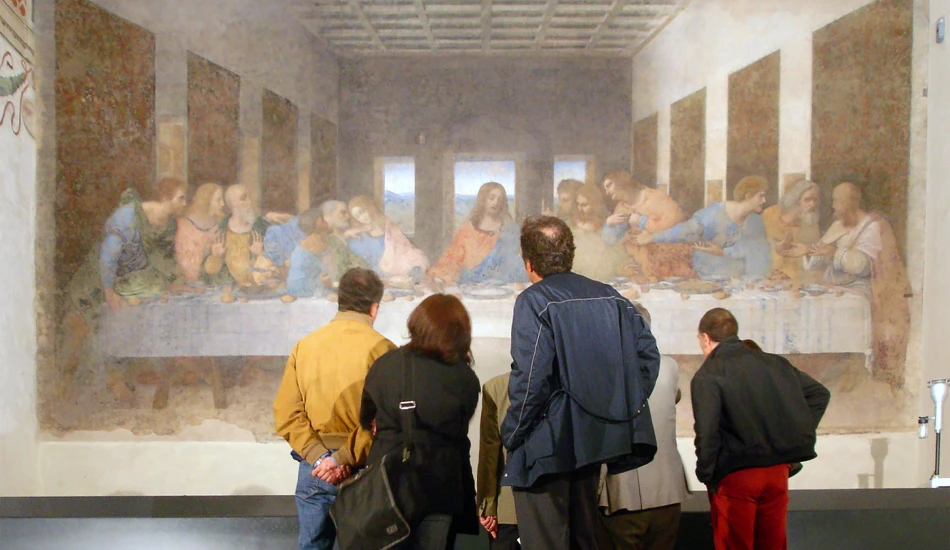 Art lovers observing The Last Supper fresco during a museum visit in Milan.
