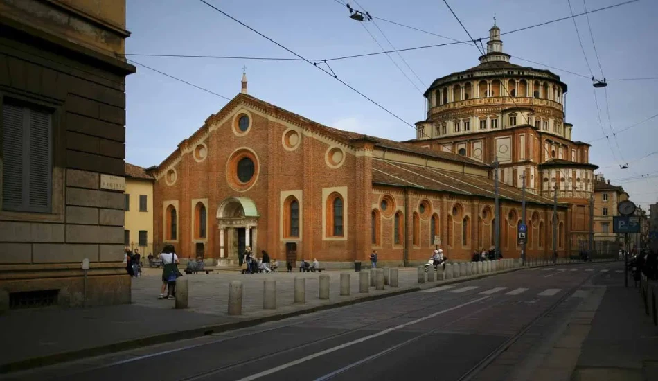 Visitors walking near the entrance of Santa Maria delle Grazie, Milan.